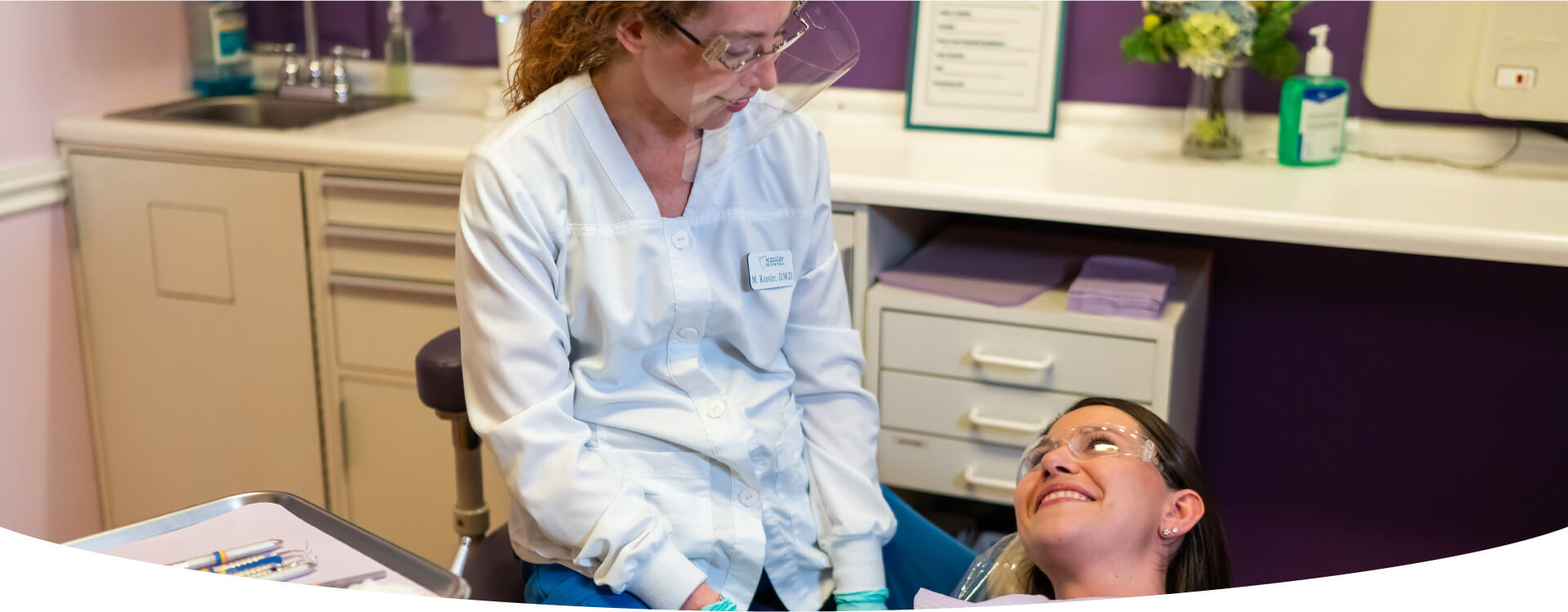 A Smiling Patient Looking At The Dentist