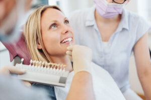 Women Smiling During A Dental Consultation For Veneers